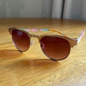 Sunglasses with club master style frames and art deco detailing